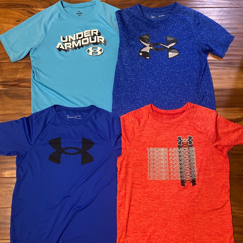 (4) boys size large Under Armour dri-fit shirts. Near perfect condition